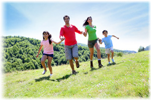 Young family running across their land