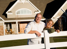 Couple outside their home