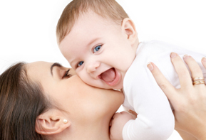 laughing baby playing with mother