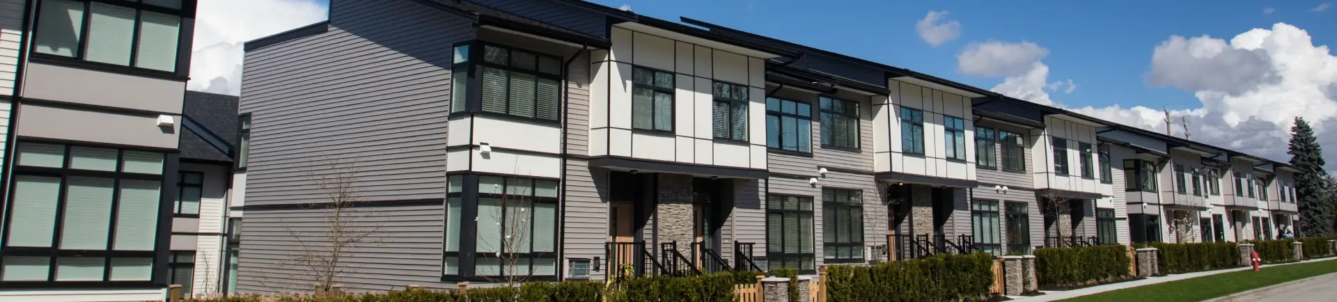 A row of two storey attached houses.