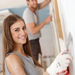 A young couple renovating a house