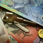 Australian money with house key on top
