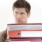 A young borrower carrying files