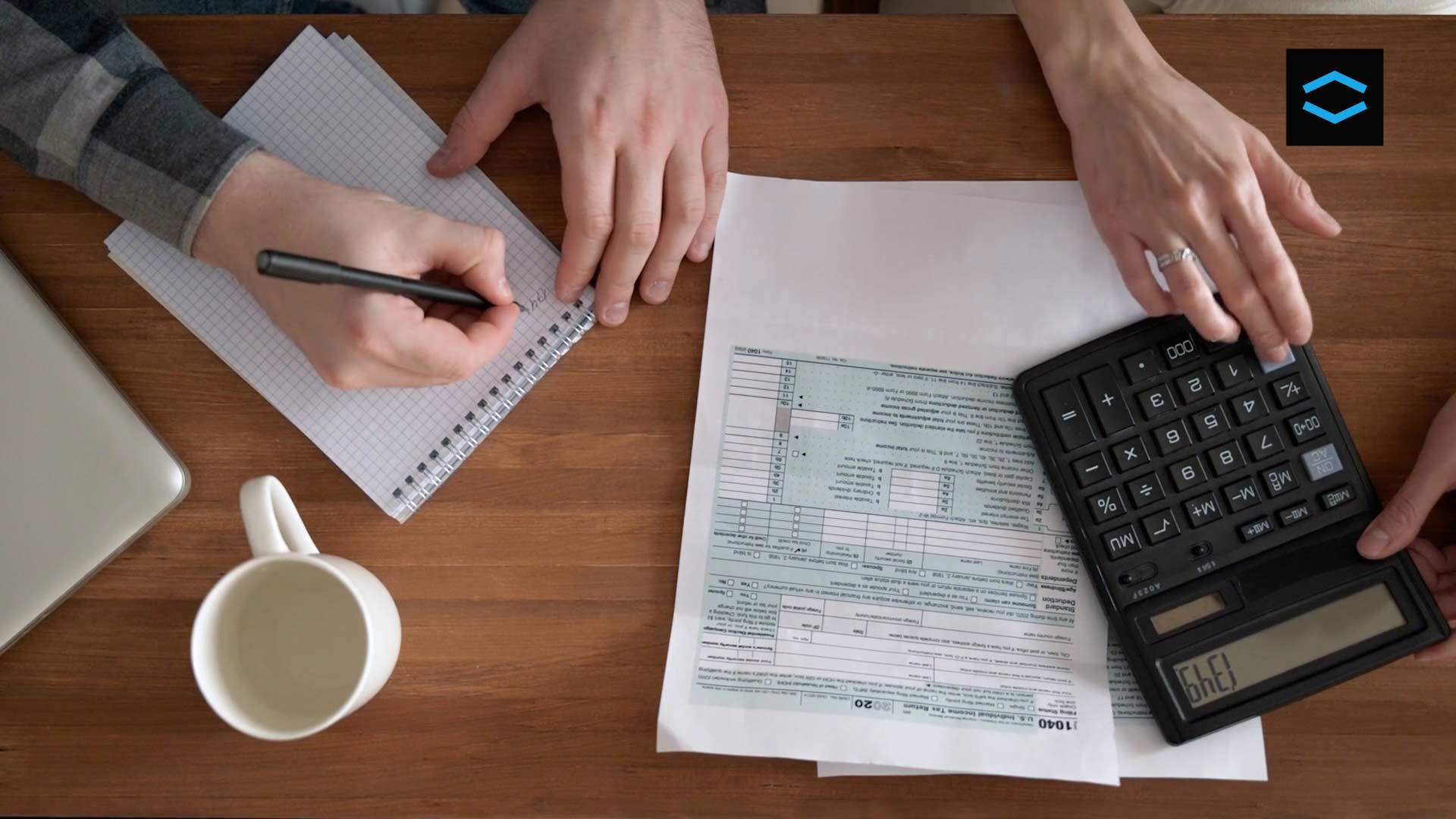 calculating and comparing the best home loan deal with a notepad and a calculator