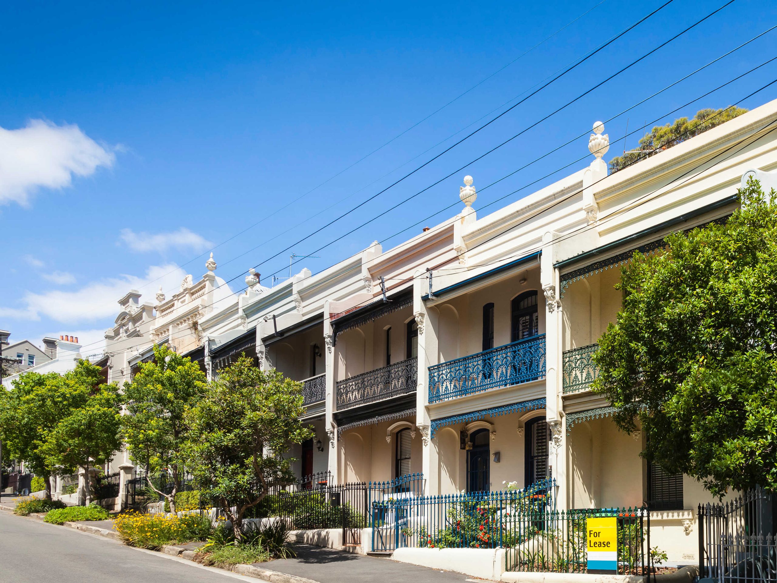 a row of 5 similar looking attached terrace houses