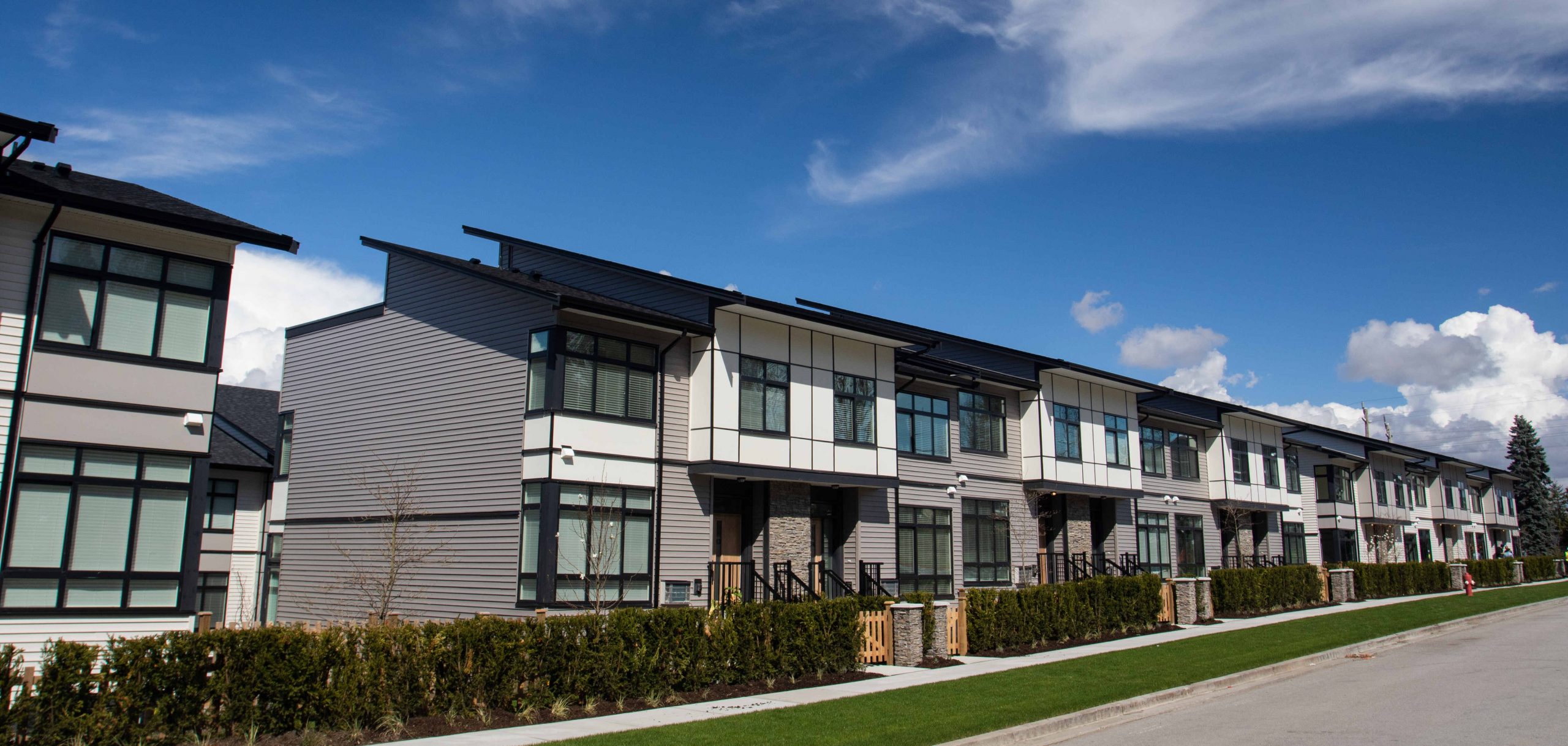 A row of five identical houses attached houses