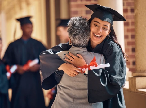 Student's Graduation Ceremony and Embracing Her Father