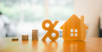 miniature house with a percentage symbol