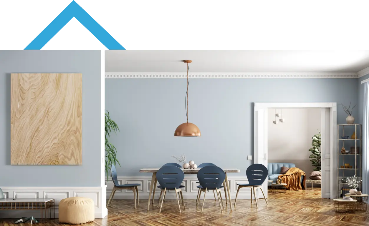 Happy couple embracing in their modern living room, representing homeownership and financial stability.
