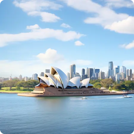 Sydney Opera House with the city skyline and harbor in the background.