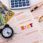 ATO tax debt form with calculator, pen, clock and money