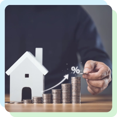 a miniature house with coins