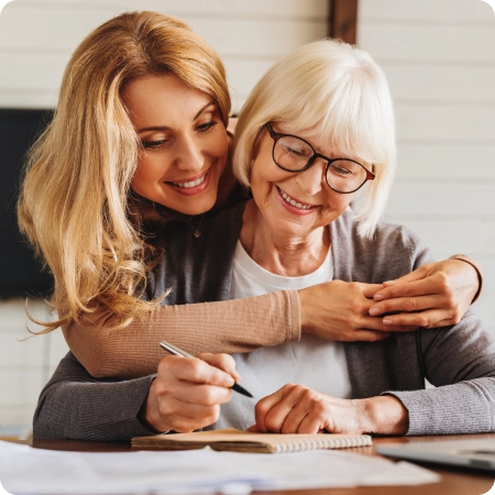 a young woman hugging her mother